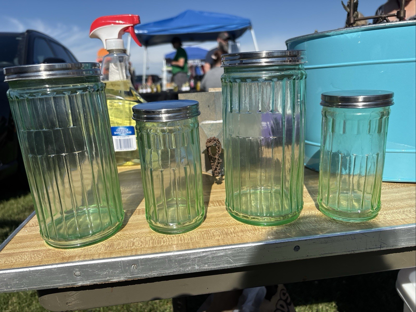Vintage green glass ribbed storage containers with tin lids-