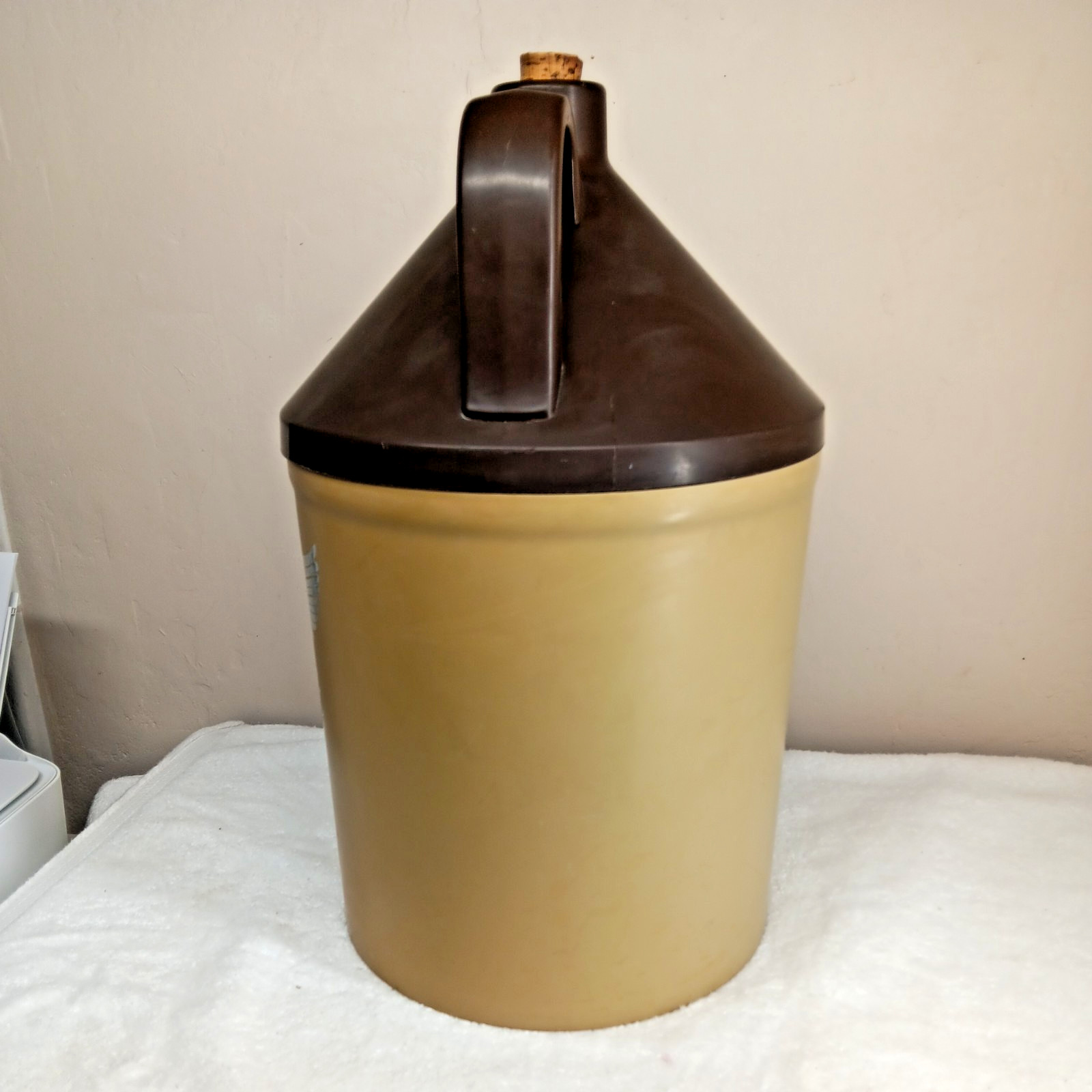 very large plastic “little brown jug”storage container American emblem on front