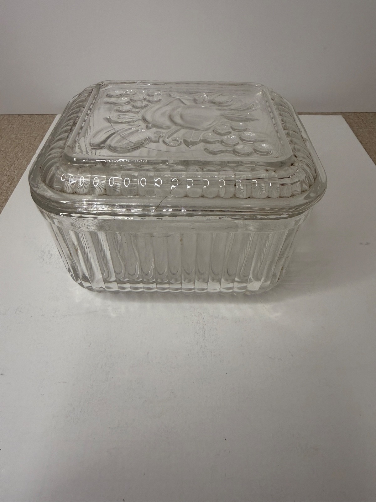 Vintage Federal Glass clear refrigerator dish features an embossed Fruit lid