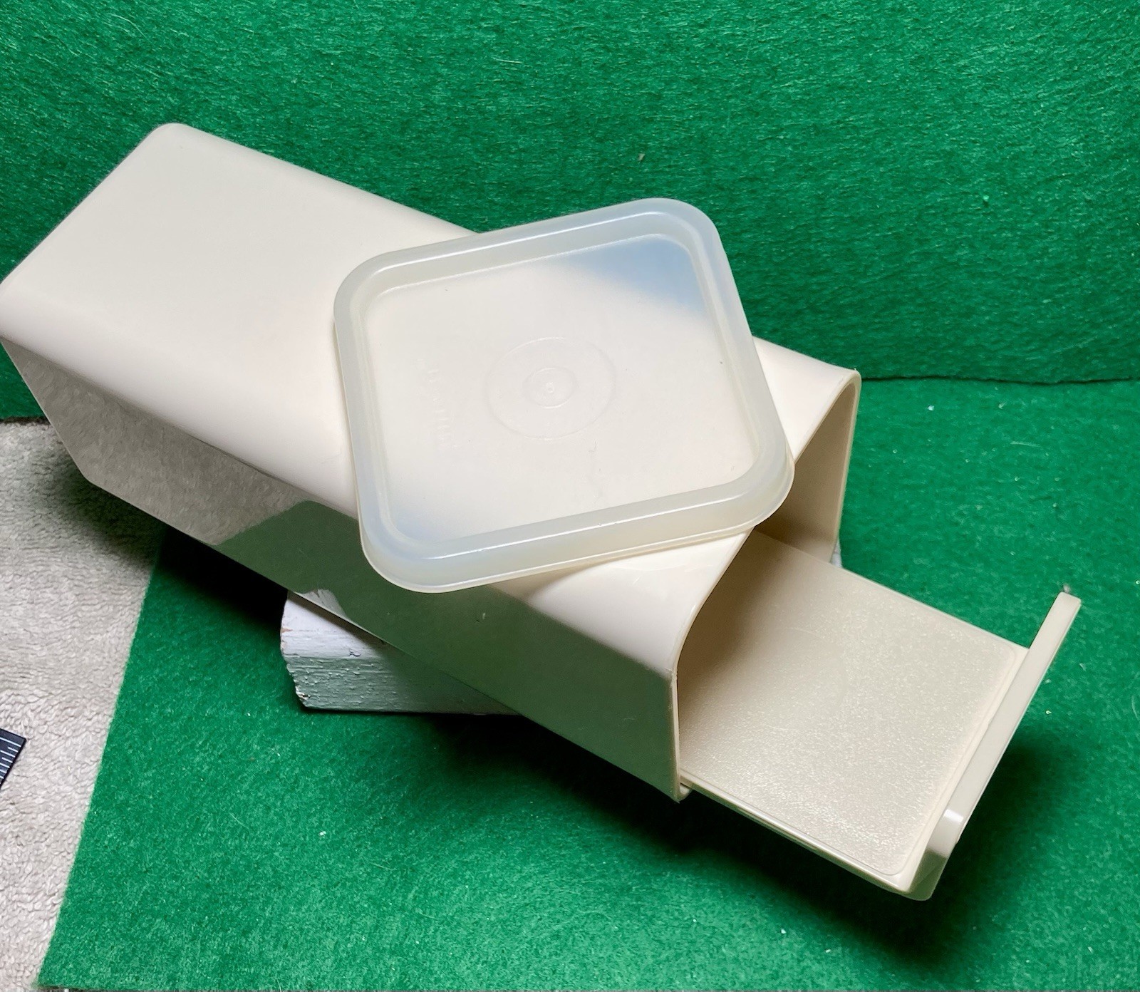Tupperware cheese keeper #1827-3 container, a slide-out tray, and a lid Vintage