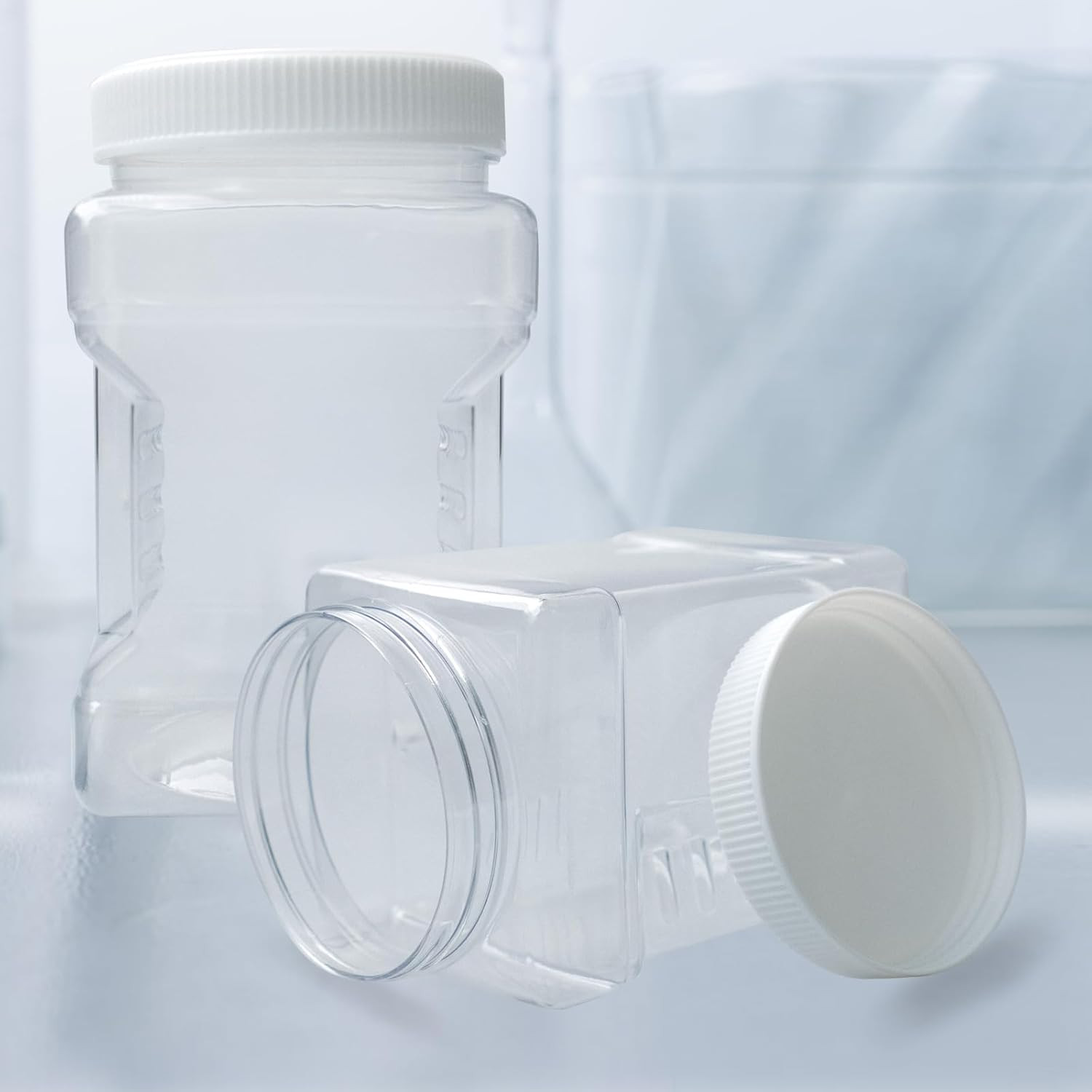 18 Pack Clear Plastic Storage Jars with Lids,27 Oz Easy Grip Handles Plastic Con