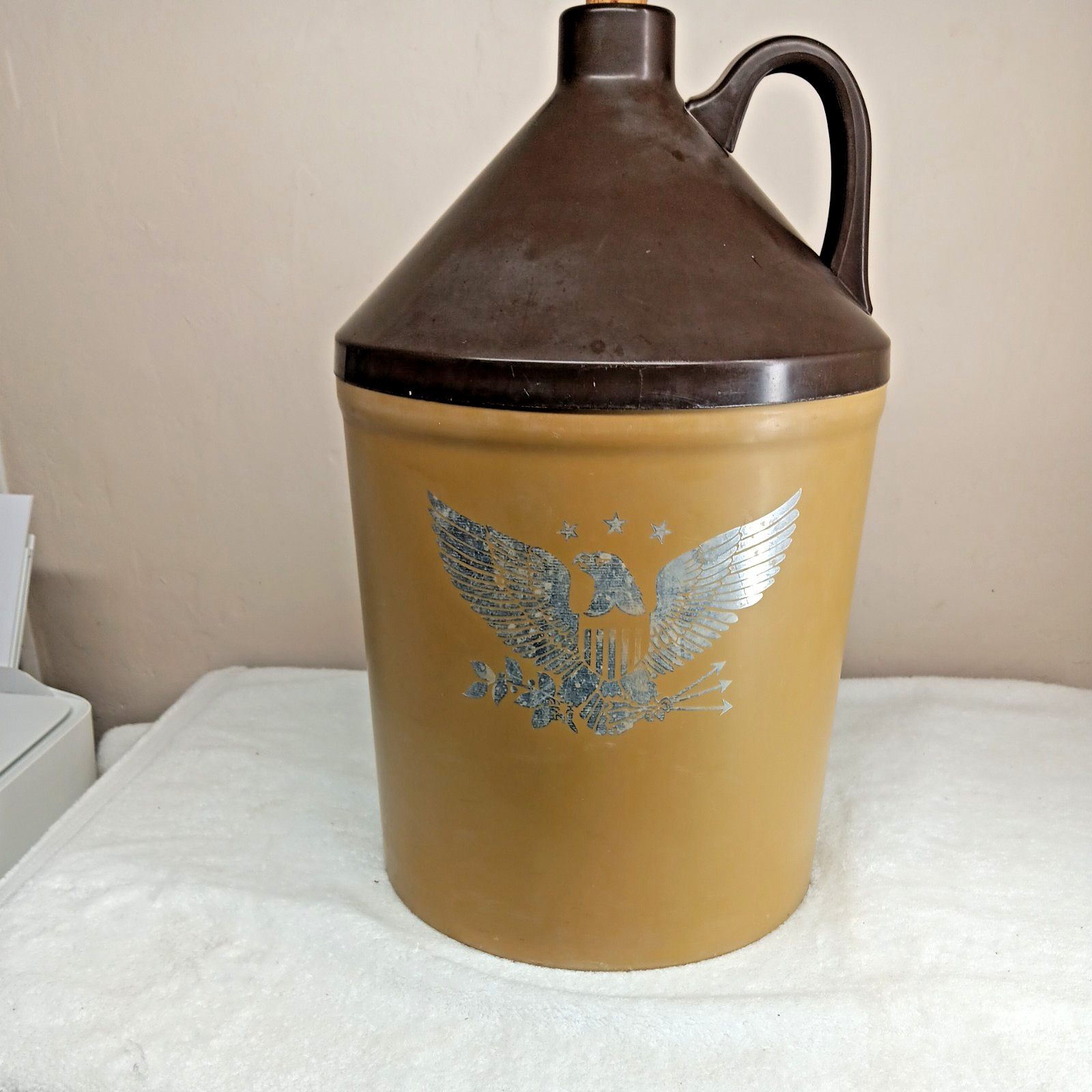 very large plastic “little brown jug”storage container American emblem on front