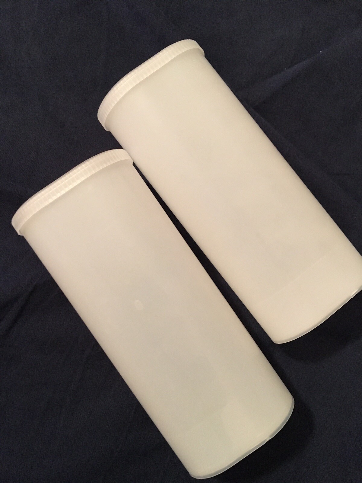 2 Plastic Storage Containers, Snap On Lids, about 6.5” long, 2.75” wide, 2” deep