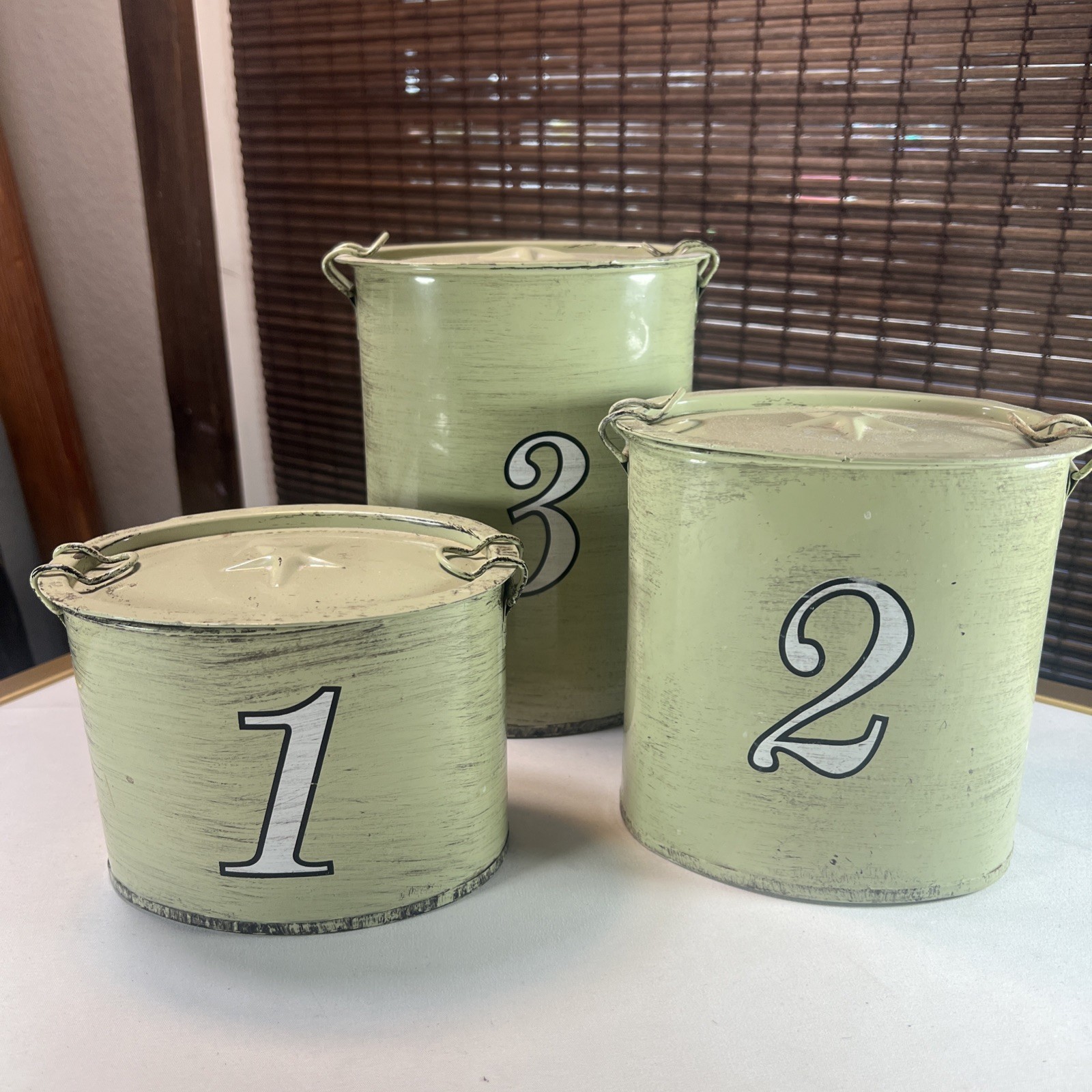 Three Piece Storage Tins Green Numbers Star On Lid.