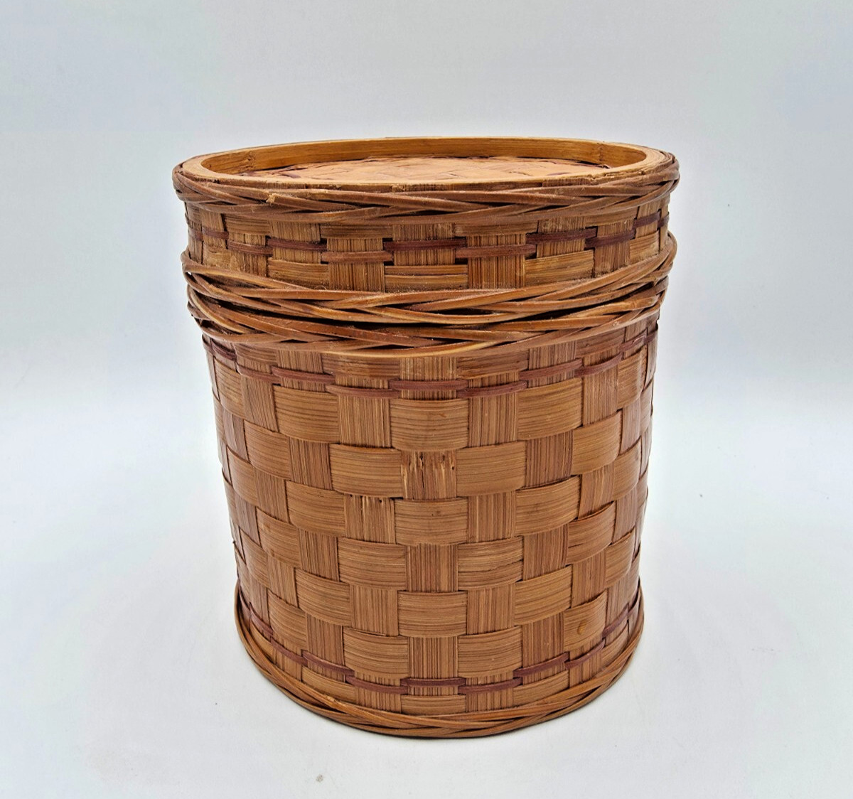 Vintage 5″ Rattan lidded storage container with white with blue enamel insert