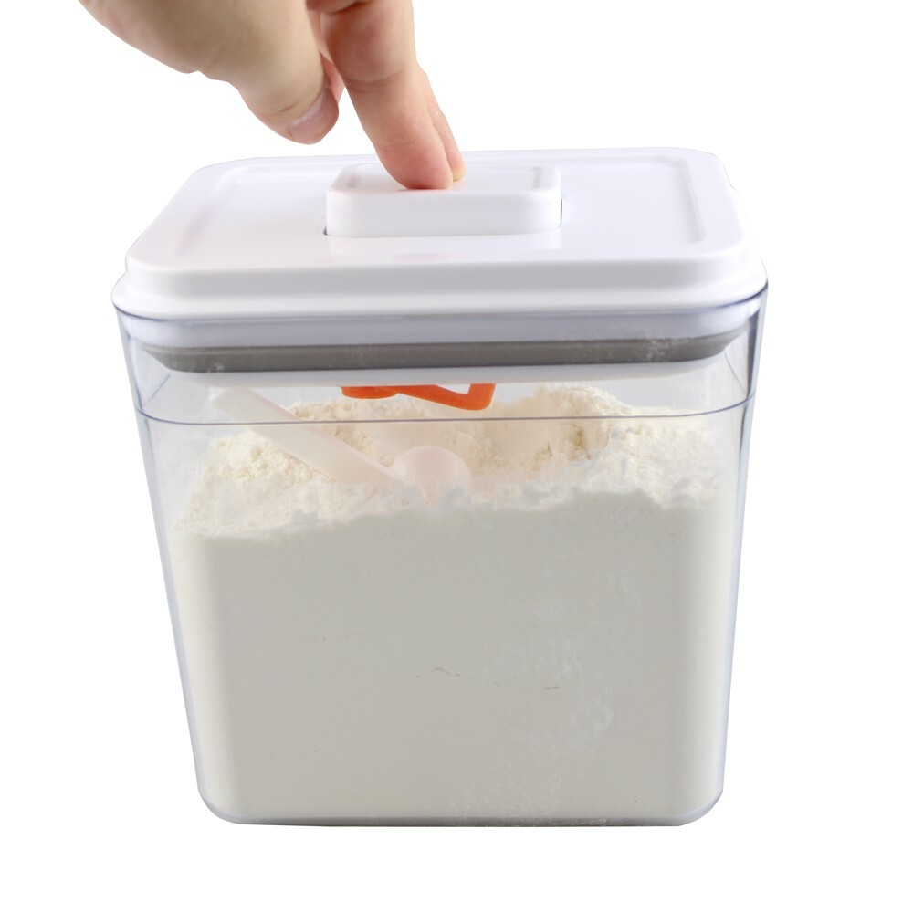 Storage container for milk powder or food opening by pressing a button