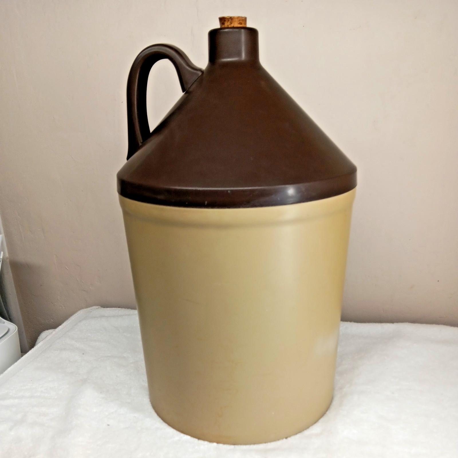 very large plastic “little brown jug”storage container American emblem on front